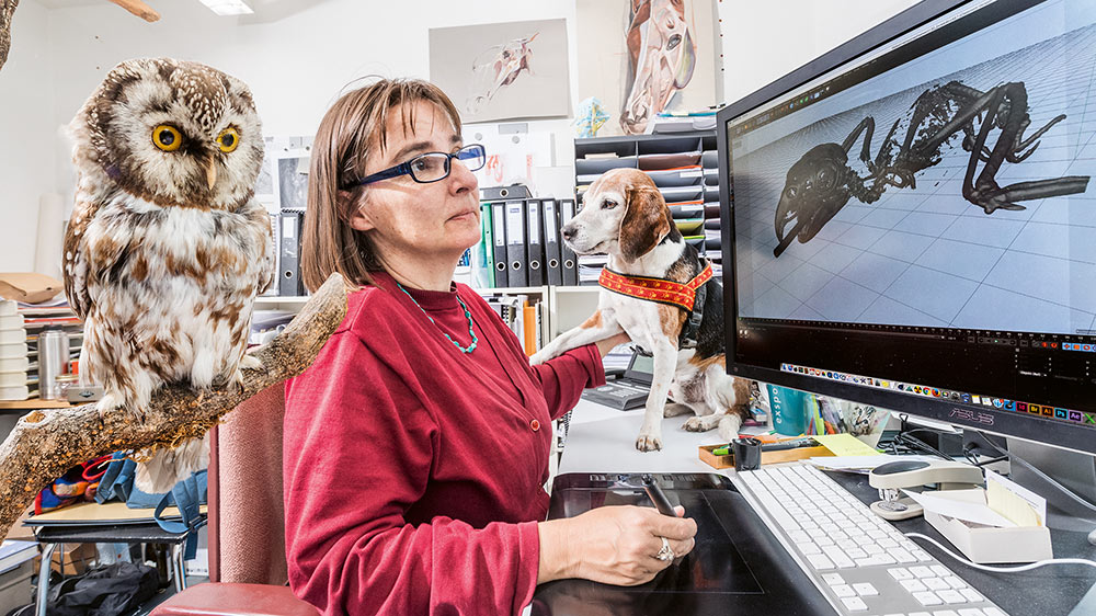 Jeanne Peter at work in front of a computer screen.