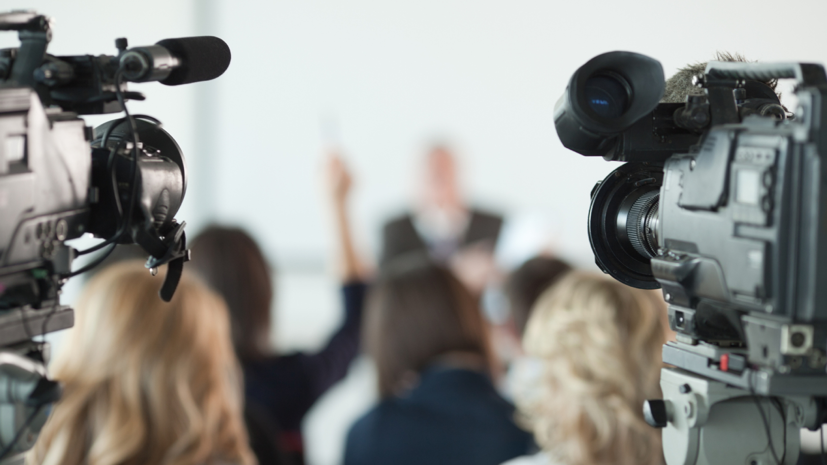 Media conference with two cameras in the foreground